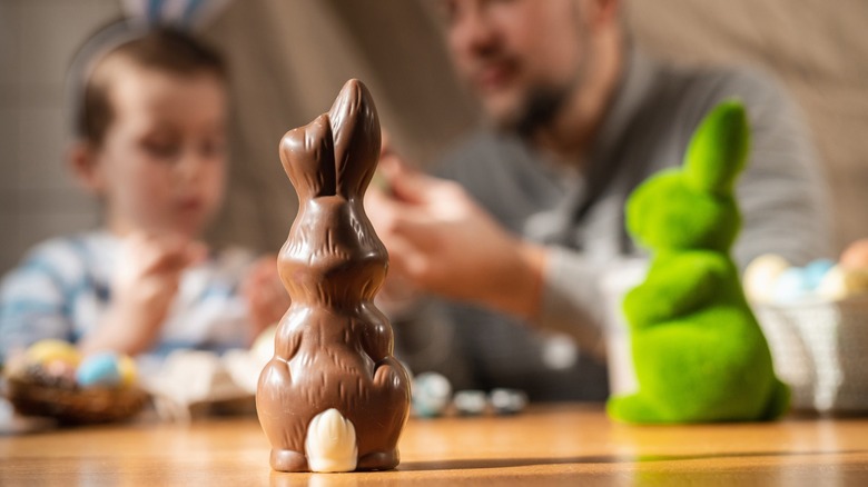 A father and child with a chocolate Easter bunny