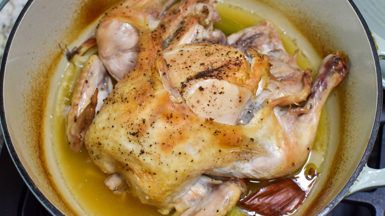 cooked whole chicken in pot