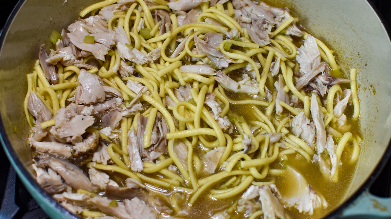 chicken and noodles in pot