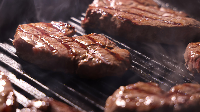 Close up of steaks on grill pan 