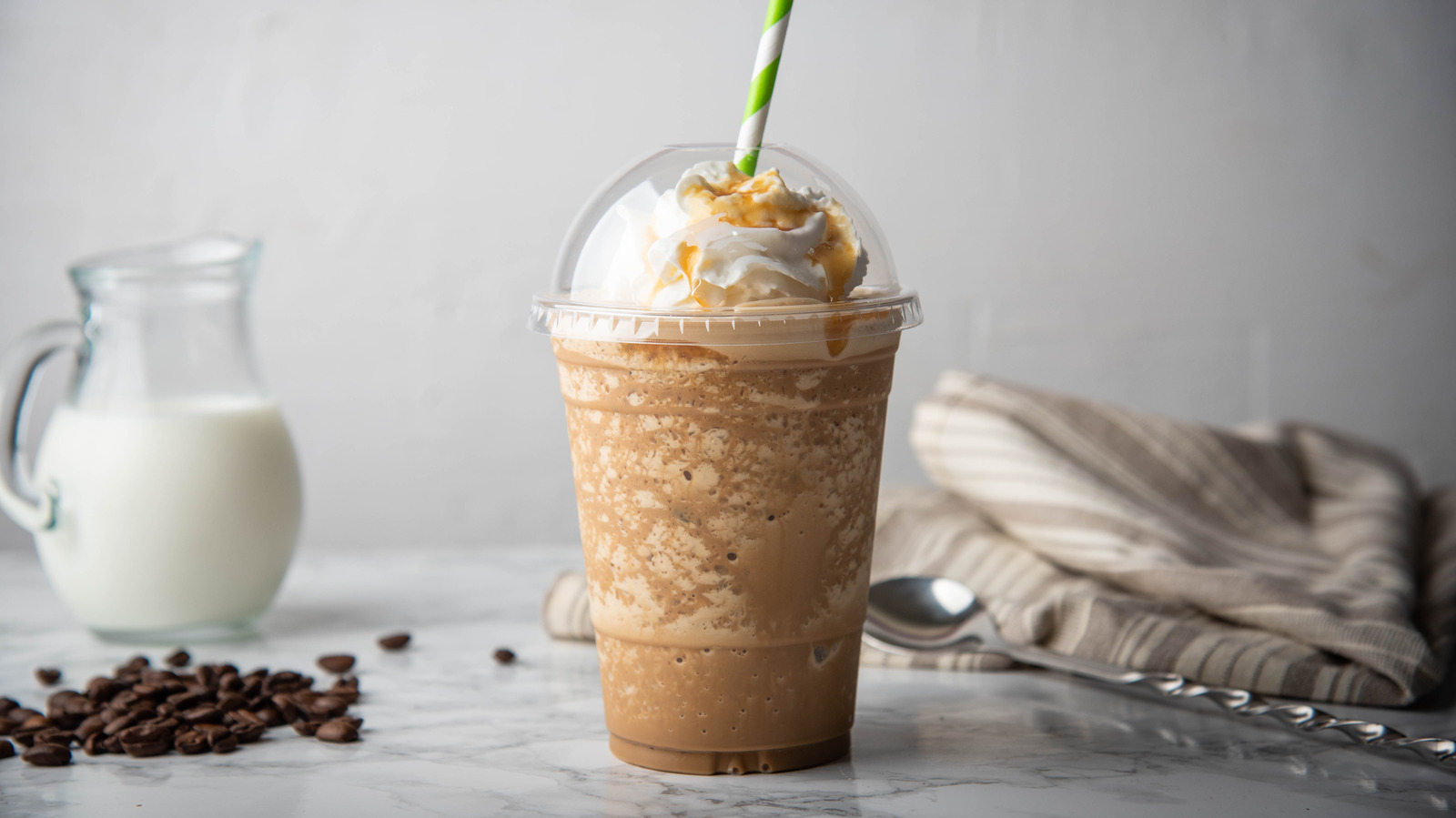 Iced Coffee Cocktail Or Frappe With Ice Cubes And Cream In