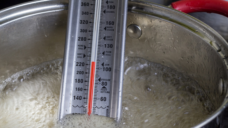 thermometer in pot of boiling sugar