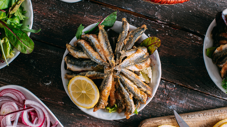 Anchovies with lemon slice