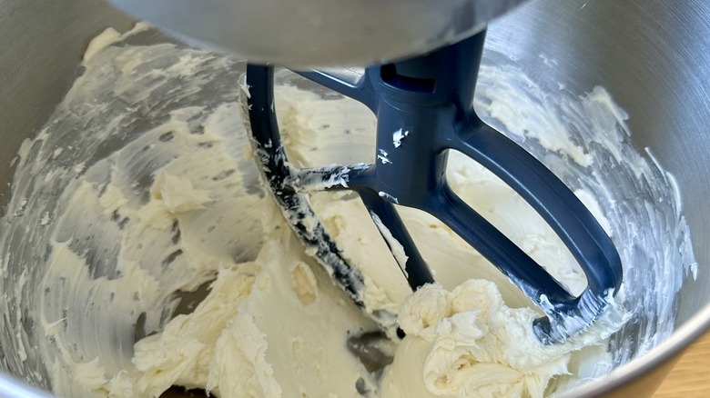 Beating cream cheese and butter