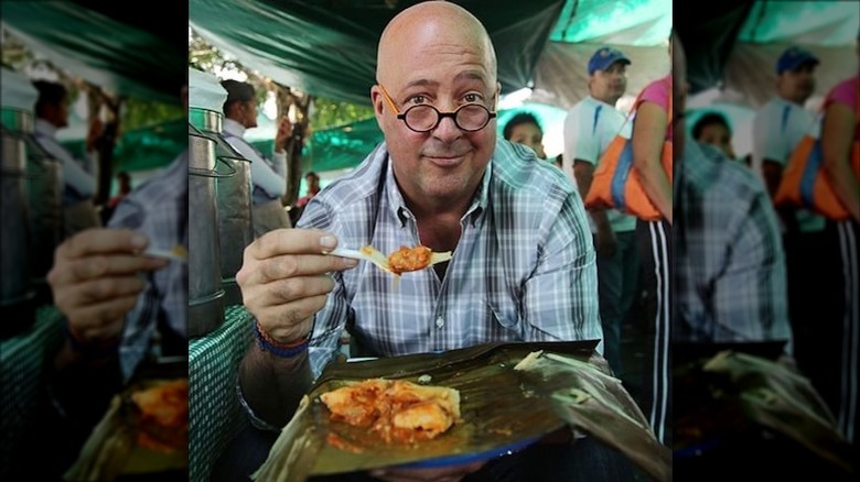 Andrew Zimmern eating street food