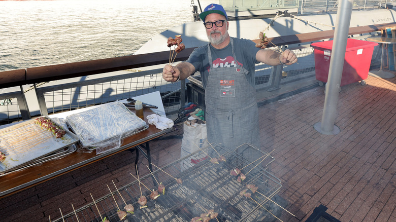 Andrew Zimmern cooking at NYCWCC barbecue