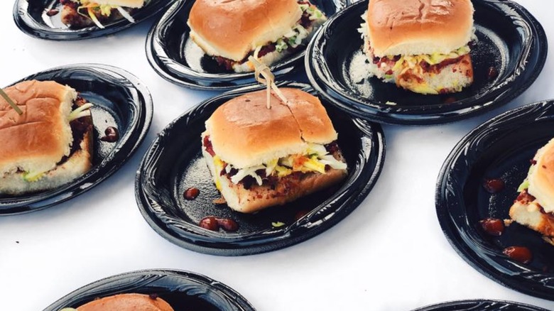 Sandwiches from the Big Apple Inn on black plates