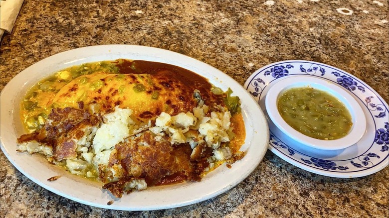 Plates on the table with spicy green chile