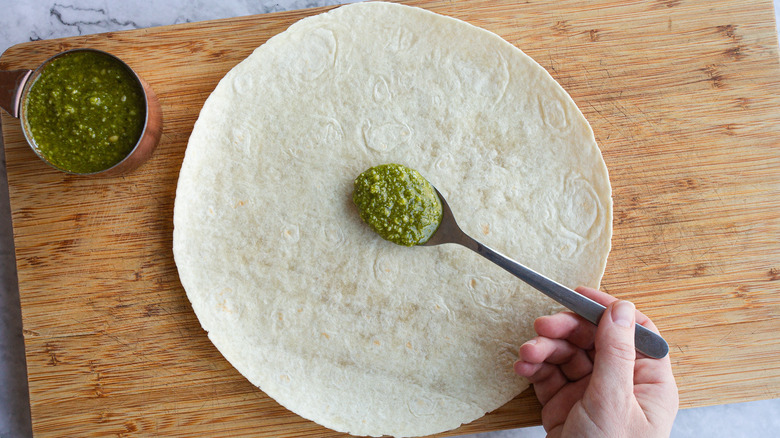 Adding pesto to a wrap