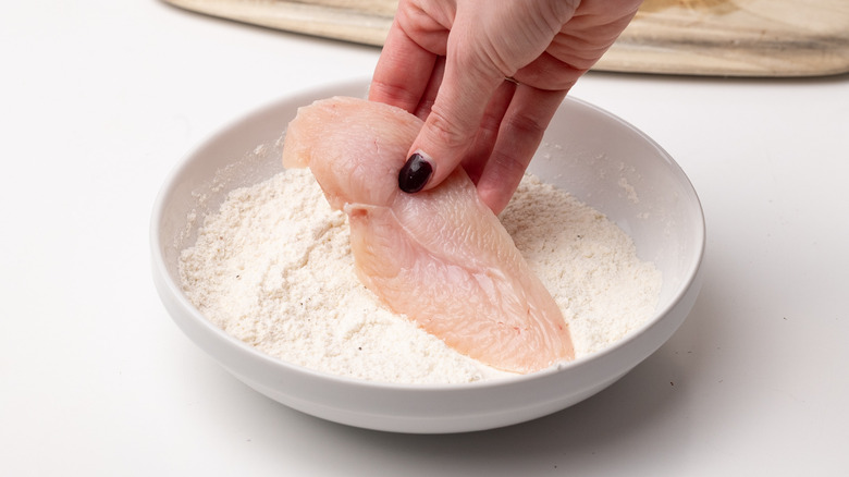 coating chicken in flour