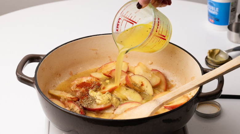 pouring stock into a pan