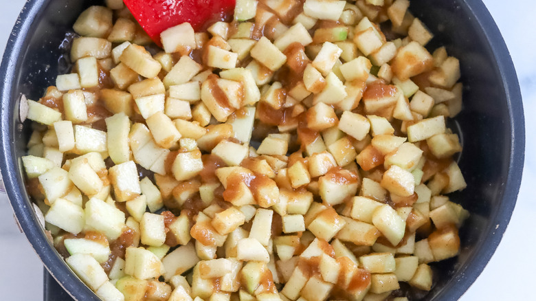 Chopped apple mixture cooking in a pan