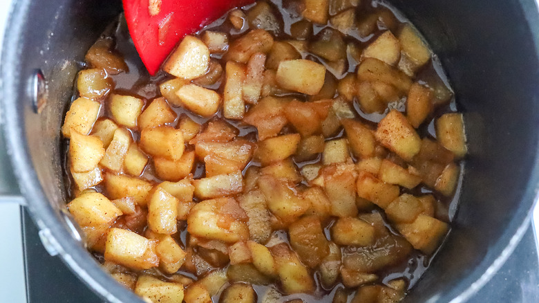 cooked apple filing in a saucepan