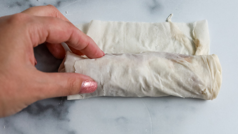 phyllo roll being rolled up