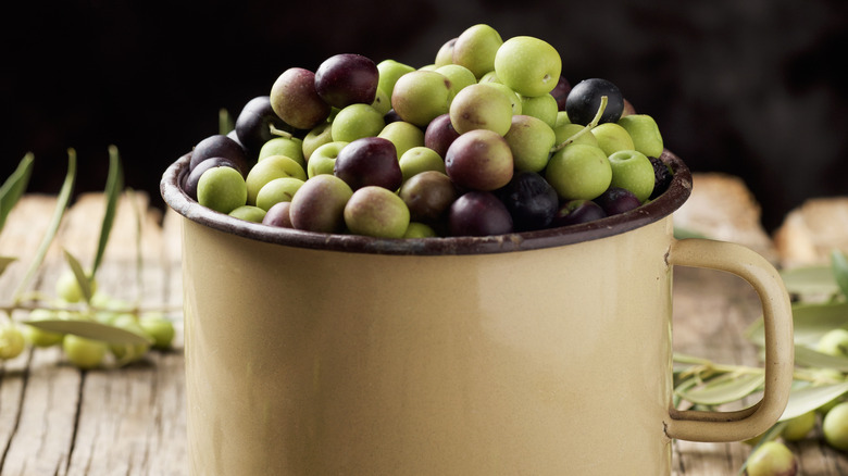 Cup full of Arbequina olives