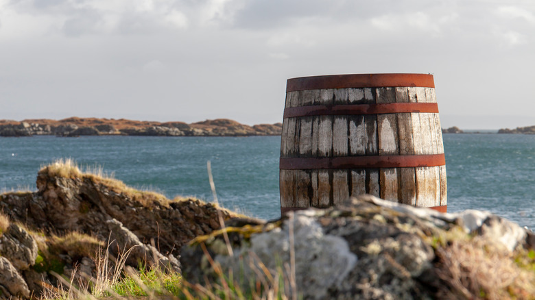 Cask of Ardbeg whisky oceanside