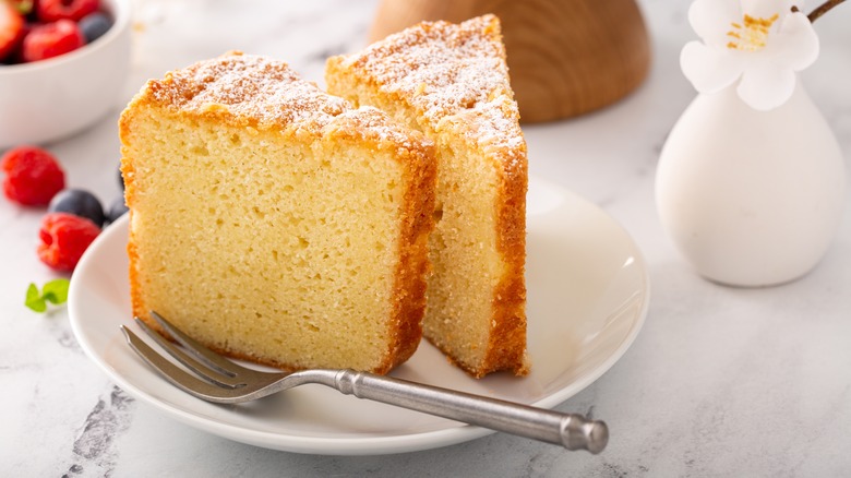 Slice of vanilla cake on white plate