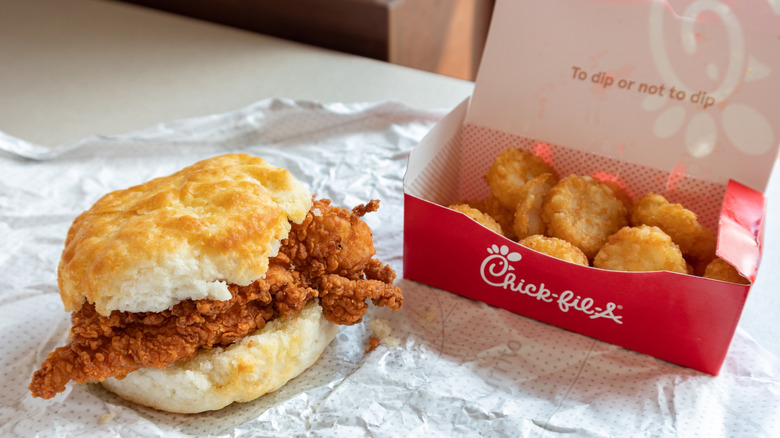 Chick-fil-A breakfast sandwich and hashbrowns on a table