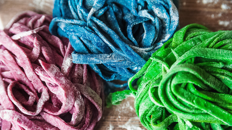 Purple, blue and green dyed fresh pasta