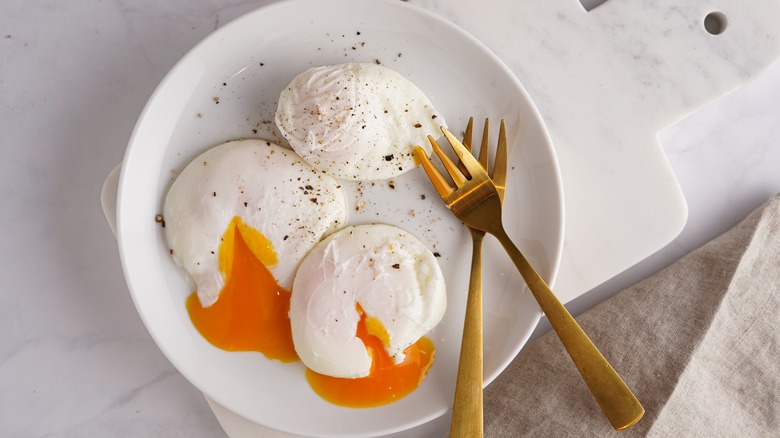 three poached eggs on plate