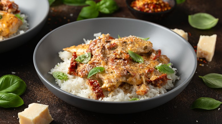 bowl of marry me chicken over rice