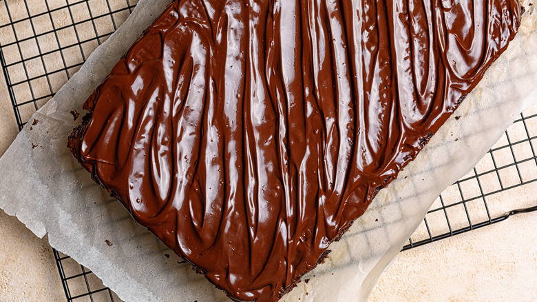 chocolate sheet cake on cooling rack