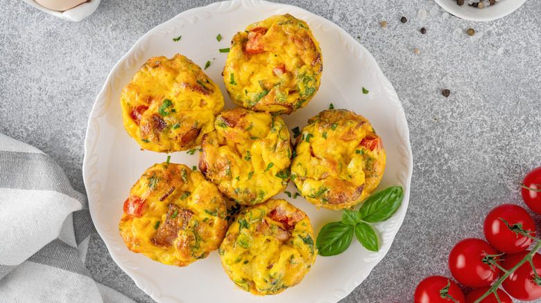 Plate of egg bites with tomatoes