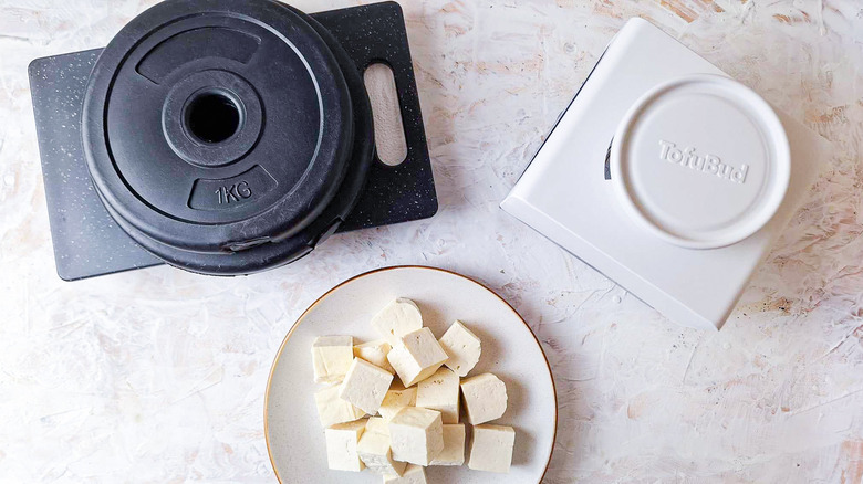 Tofu presses with cubed tofu