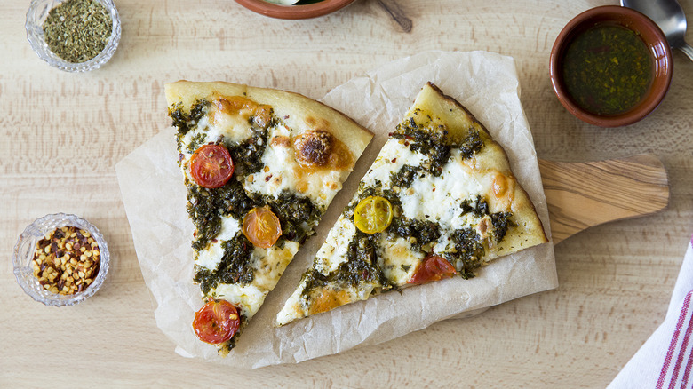 chimichurri pizza slices on table