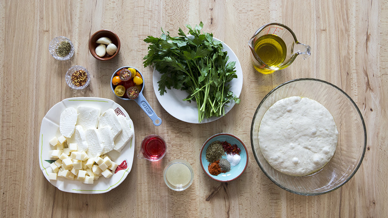 chimichurri pizza ingredients on table