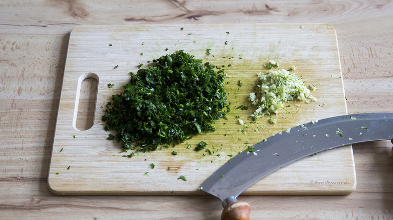 chopped parsley on cutting board