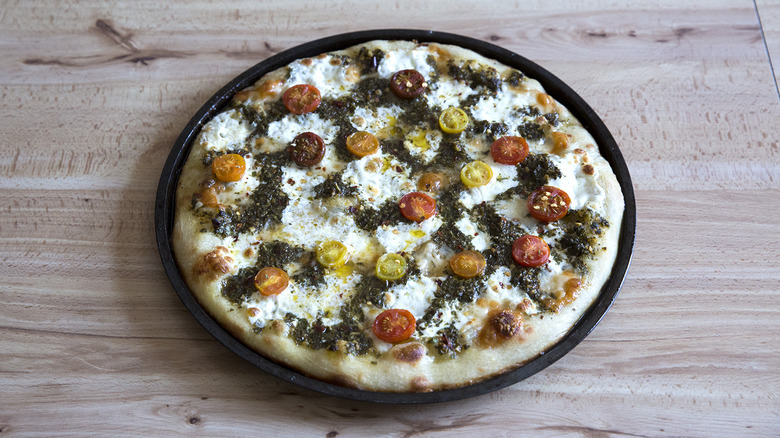 chimichurri pizza on table