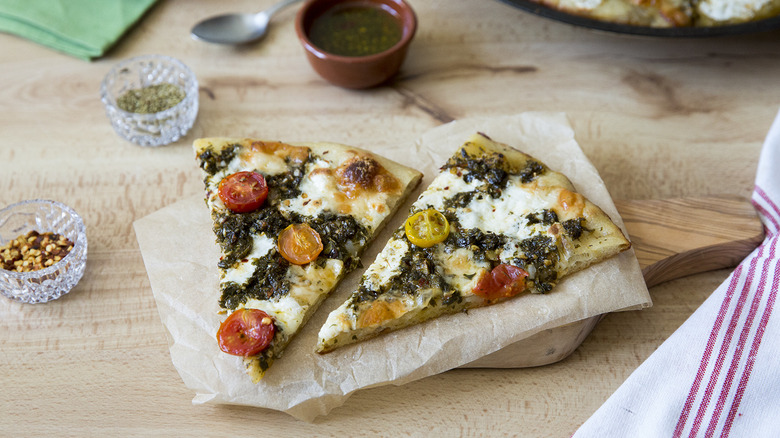 chimichurri pizza served on table