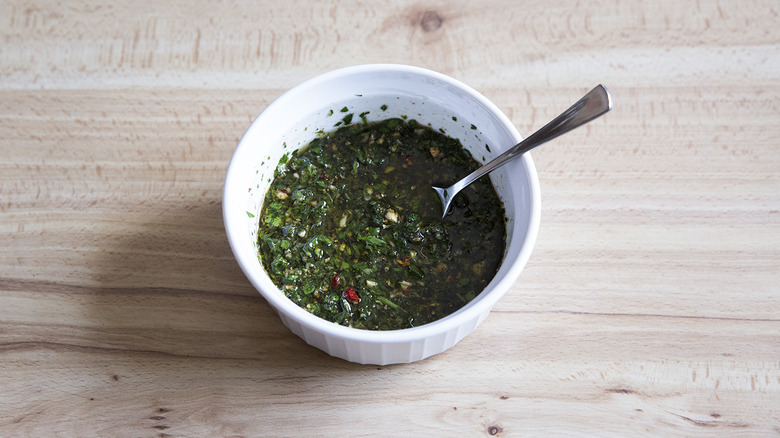 chimichurri in small white bowl