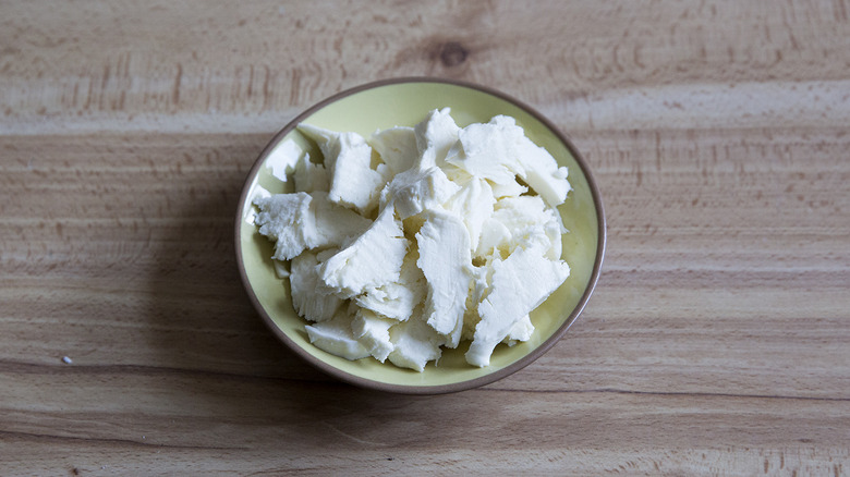 torn mozzarella in small bowl