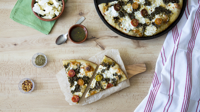 chimichurri pizza served on table