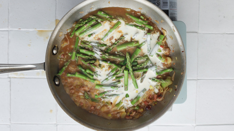 Pan with simmering asparagus