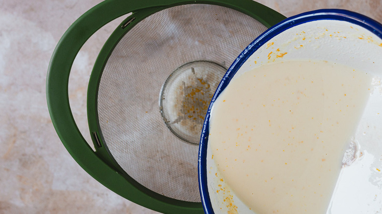 Running creamer through strainer