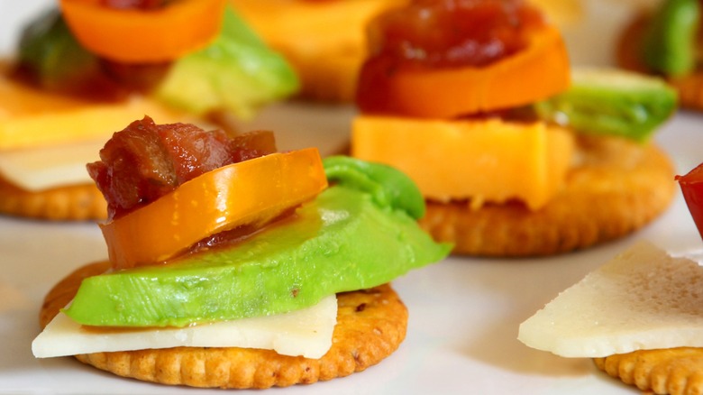 Ritz crackers topped with charcuterie cheese and bites