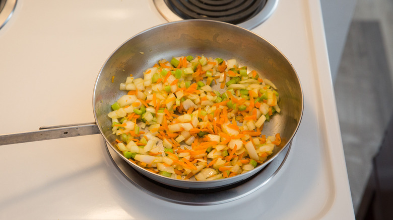 vegetables sauteing in pan