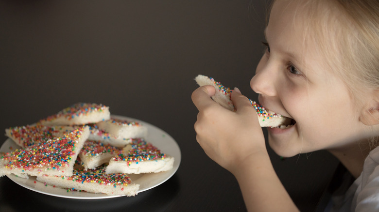 Child eating fairy bread
