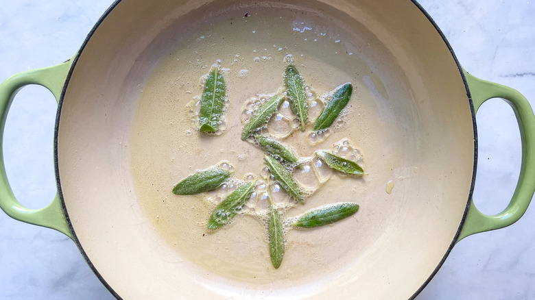 sage leaves frying in pan