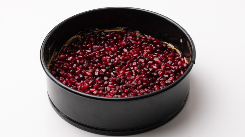 Pomegranate in a cake tin