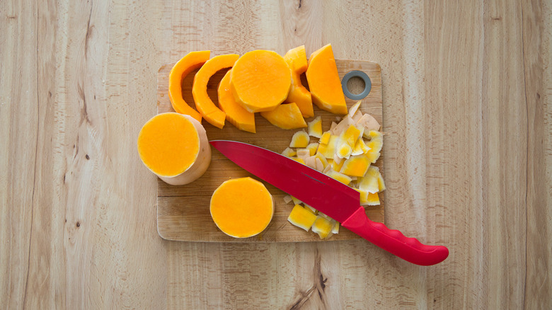 peeled butternut squash on board 