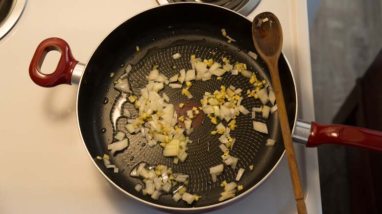 onion and ginger in pan