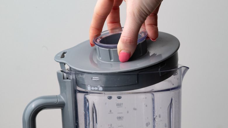 Placing lid on a blender