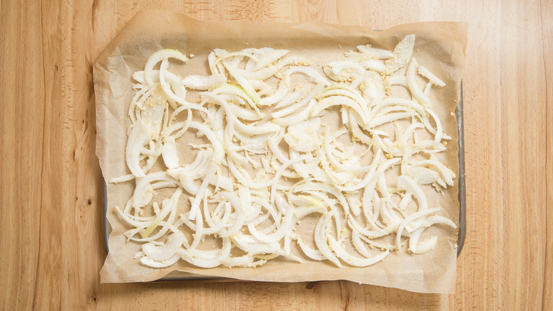 coated onions on baking sheet
