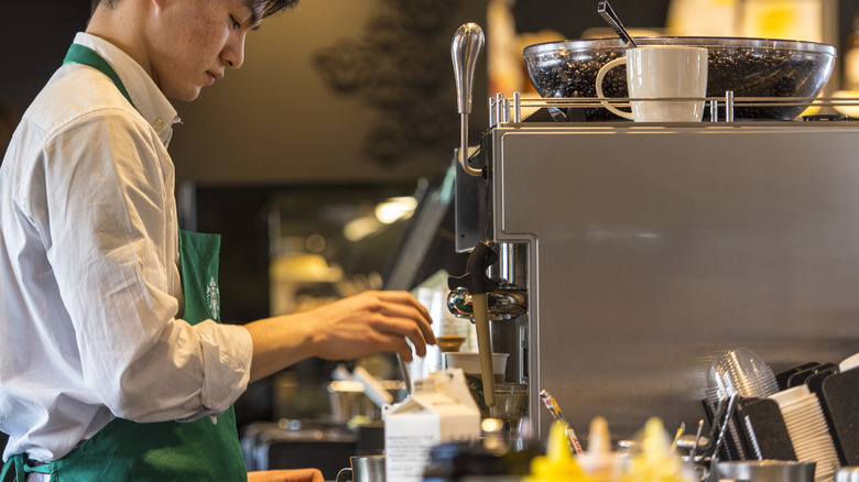 Starbucks barista making drinks