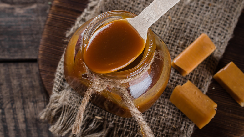 Spoonful butterscotch jar candies surrounded