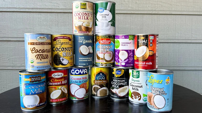 Canned coconut milk brands stacked together